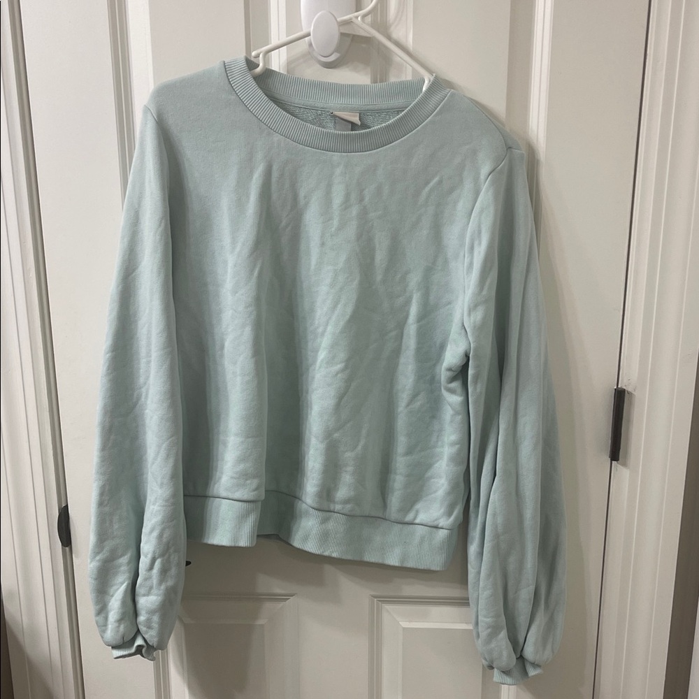 a new day Soft Blue Sweatshirt